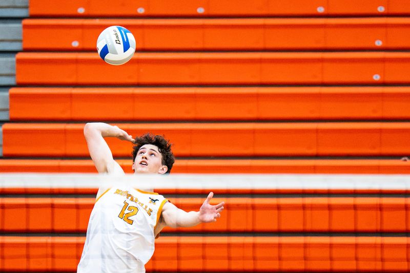 Northville High School's Jude Butler (12) returns the ball during the MHSAA Division 1 boys volleyball regional final against Saline High School at Northville High School in Northville, Mich., on Thursday, May 28, 2026.