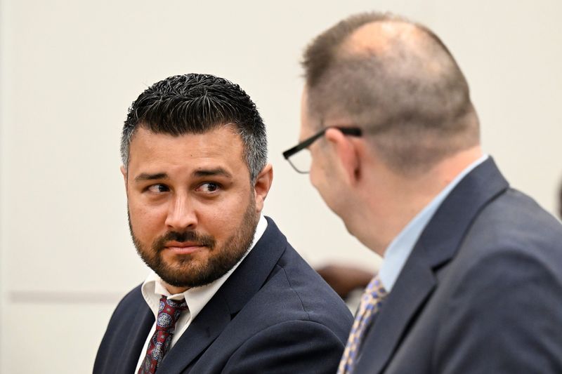 Former Melvindale Police Lt. Matthew Furman, left, listens to his attorney, Dennis Whittie, during sentencing proceedings in the courtroom of Judge Mark Slavens, Friday, May 29, 2026, at the Wayne County Criminal Justice Center in Detroit.