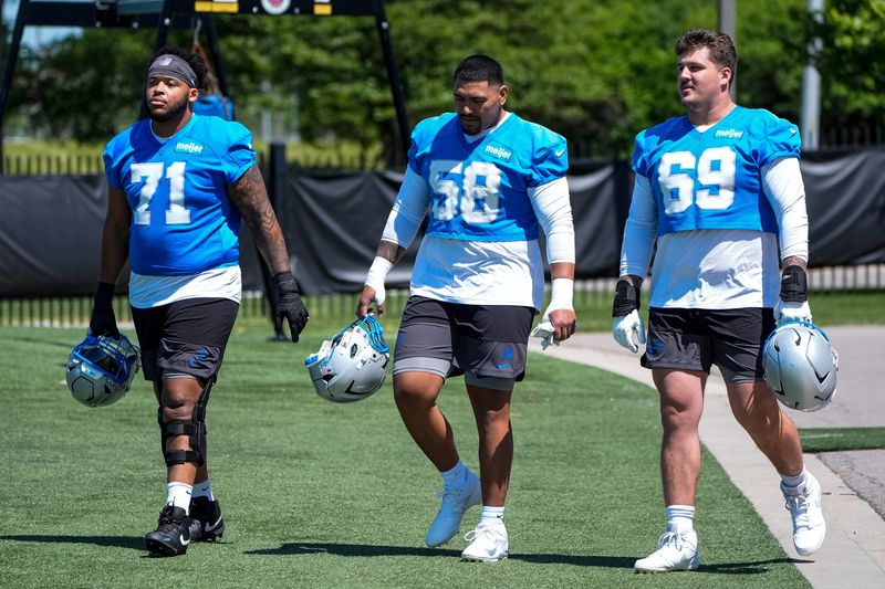 Detroit Lions guard Miles Frazier (71), offensive tackle Penei Sewell (58) and guard Tate Ratledge (69) during OTAs at Meijer Performance Center in Allen Park on Friday, May 29, 2026.
