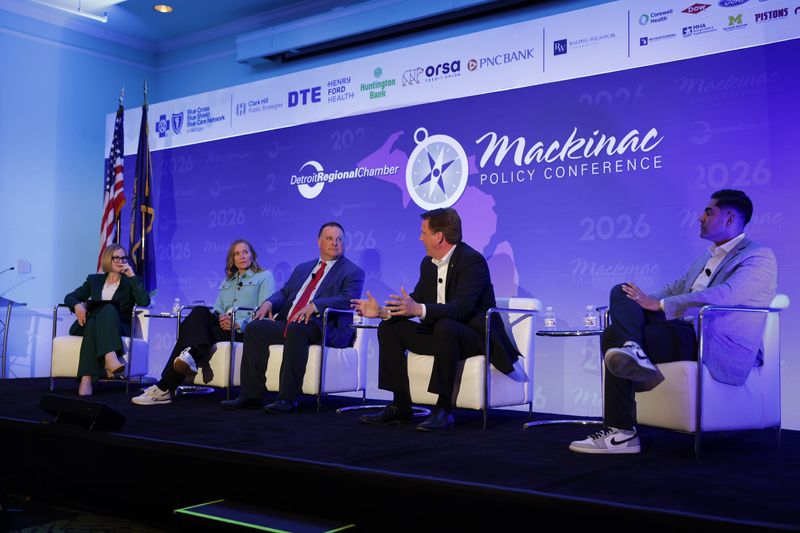 Moderator Zoe Clark of Michigan Radio, left, questions legislative quadrant leaders at the Mackinac Policy Conference on May 28, 2026. The legislative leaders, from left to right, are Senate Majority Leader Winnie Brinks, D-Grand Rapids; House Speaker Matt Hall, R-Richland Township; Senate Minority Leader Aric Nesbitt, R-Porter Township; and House Democratic Leader Ranjeev Puri, D-Canton.