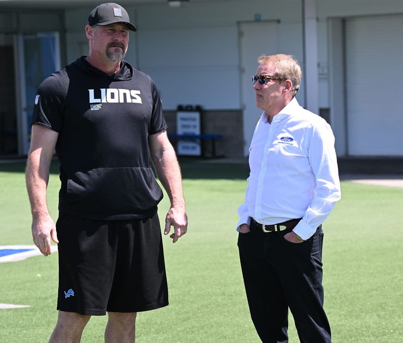 Dan Campbell, at left with Bill Ford Jr. on Friday, says nothing anyone does at May OTAs is worth getting too hyped up about.