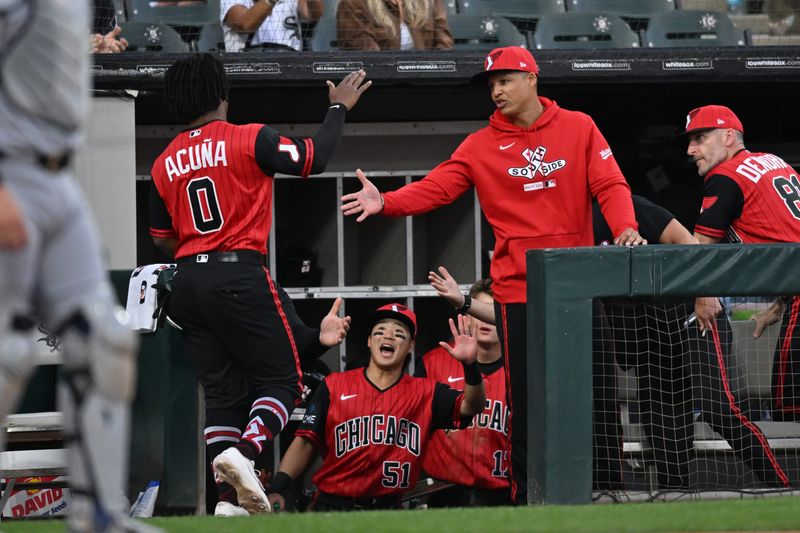 Chicago White Sox pinch-runner Luisangel Acuna (0) celebrates with right fielder Rikuu Nishida (51), manager Will Vennable (1) and his team after scoring against the Detroit Tigers during the third inning at Rate Field in Chicago on Friday, May 29, 2026.