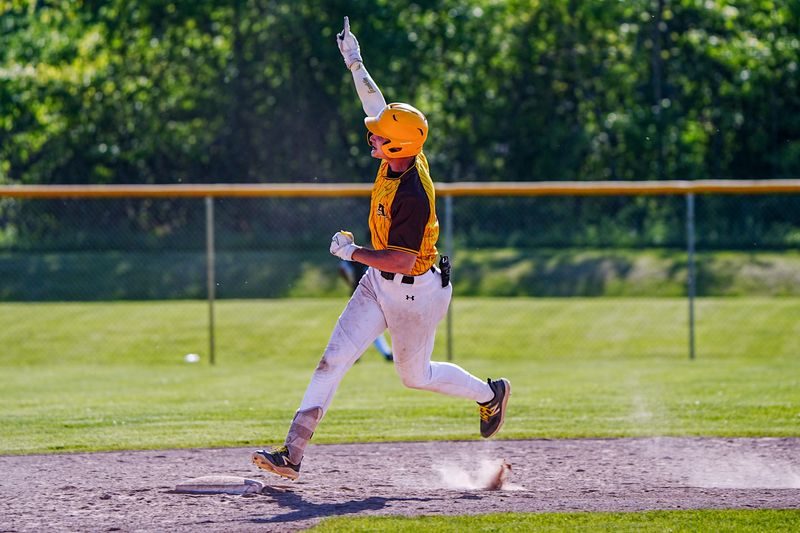 Rochester Adams OF Luke Borowski (8) hits a home run against. Rochester in the 7th inning of the MHSAA Division 1 baseball district finals at Rochester Adams high school in Rochester Hills, Mich., on Friday, May 29, 2026. Rochester Adams defeated Rochester in the MHSAA finals 7-8 in extra innings.