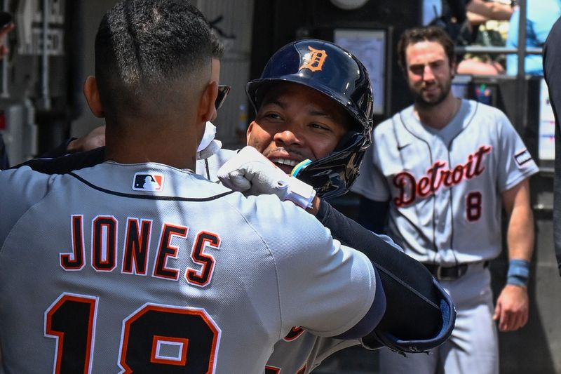 Detroit Tigers right fielder Wenceel Pérez (46) celebrates in the dugout with designated hitter Jahmai Jones (18) after hitting a home run against the Chicago White Sox during the third inning May 30, 2026; at Rate Field.