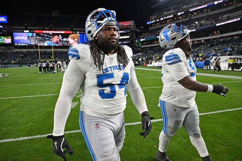 Lions defensive tackle Alim McNeill (54) and defensive tackle Tyleik Williams (91) walk off the field after a loss to the Eagles at Lincoln Financial Field.