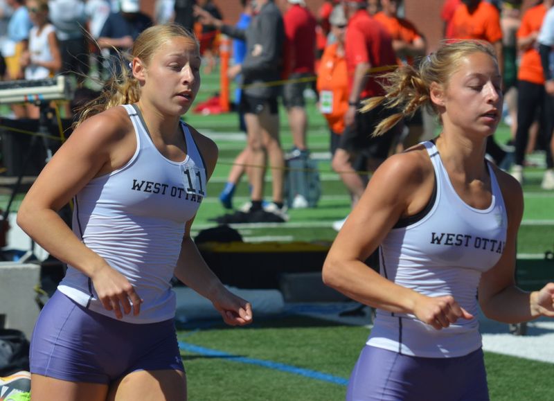 West Ottawa's Ella Wierks, left, and Collette Wierks compete in the 800 meters at the Division 1 state track and field finals on Saturday, May 30, at Rockford High School.