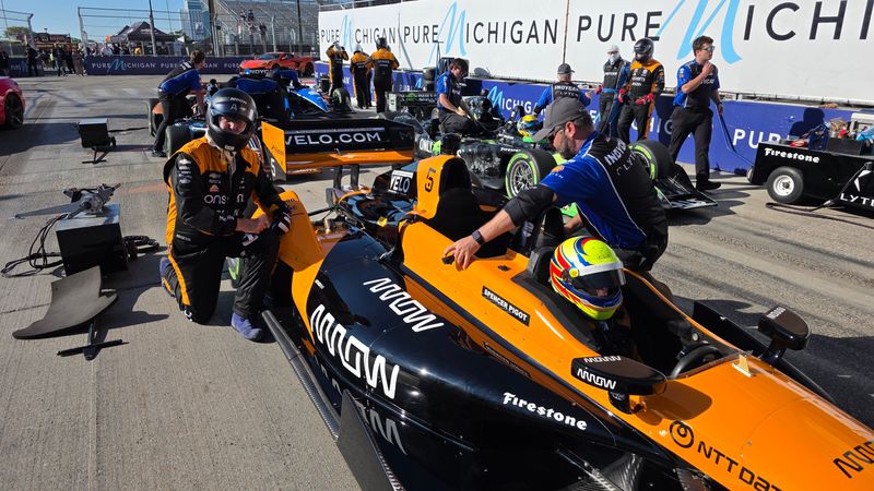 Detroit News Henry Payne (left) jumps into the IndyCar Experience Two-Seater ride along at the Detroit GP.