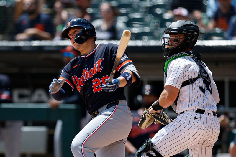 May 31, 2026; Chicago, Illinois, USA; Detroit Tigers first baseman Spencer Torkelson (20) hits an RBI-double against the Chicago White Sox during the first inning at Rate Field. Mandatory Credit: Kamil Krzaczynski-Imagn Images