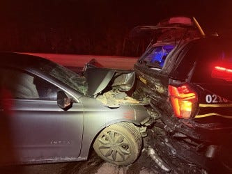 A Chevrolet Impala struck an Oakland County Sheriff's patrol car early Friday, May 29, 2026, on M-59.