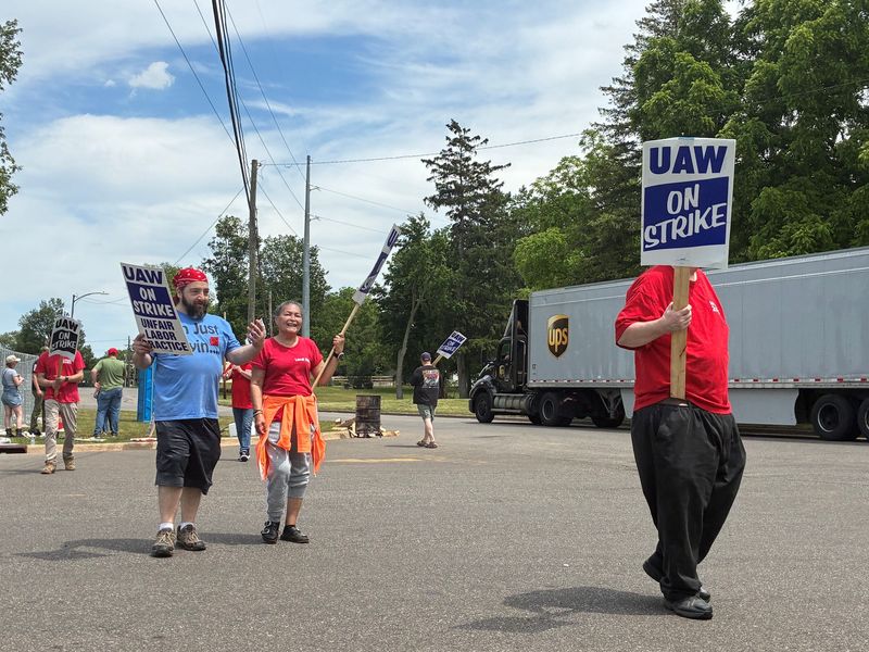 Picketers outside the American Axle/Dauch plant in Three Rivers on Monday, June 1, 2026, had the mantra: "No axles, no trucks." The plant supplies parts for GM full-size and midsize pickups.