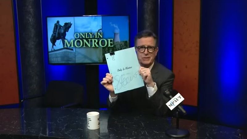 Stephen Colbert holds a signed script from his 2015 guest hosting appearance on "Only in Monroe." The script is now up for auction, with proceeds benefitting Monroe Community Media.