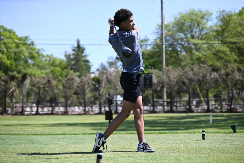 Port Huron Northern's Romen Ruiz tees off during a practice round at Port Huron Golf Club on Monday, June 1.
