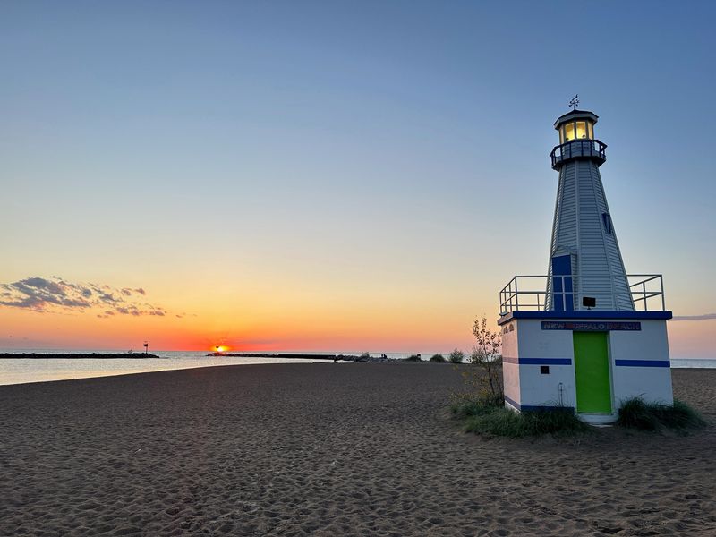 The sun goes down on New Buffalo on May 7, 2026 near the Chuck Ritter Memorial Lighthouse.