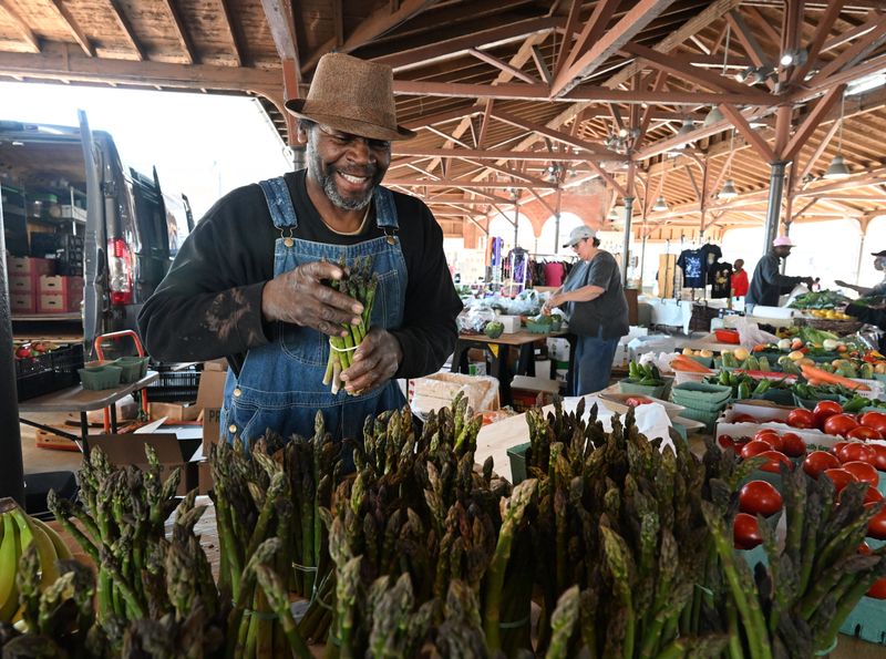 Jeffrey Byrd selling fresh fruit and vegetables including peaches at the Tuesday market at Eastern Market in Detroit, Michigan on June 2, 2026. Jeffrey Byrd, "This is the best place to be on a Tuesday. Eastern market is like a welcome to the city to the world from Detroit. If you come down here, you're going to have fun, this is the best place to be." As for freshness, "I tried a blueberry this morning, that ended up being my breakfast. Never just had blueberries for breakfast and as for the peaches, you got to come down here and try one of everything to really enjoy Michigan."