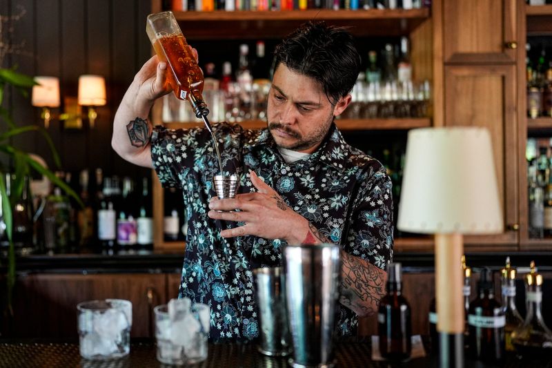 Bartender Ryan Sebastian prepares a drink at Father Forgive Me in Detroit on Thursday, May 28, 2026.