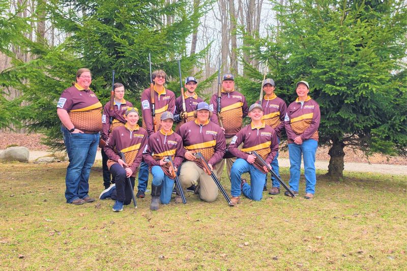In this photo, members of the Pellston High School clay target team include (back, from left) coach Kathleen Blust, Landyn Mallory, Nick Bennett, Elias Hutchinson, Wiigwaas Craven, coach Tina Giannini, (front, from left), Brayden Newman-Barr, Myles Young, Braden Sutton and Jace Kerr.
