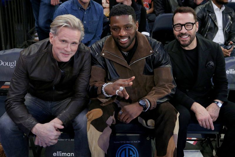 English actor Cary Elwes, left, and American actors Everett Osborne and Jeremy Piven pose for a photo sitting courtside during the third quarter between the New York Knicks and the Miami Heat at Madison Square Garden on March 29, 2023.