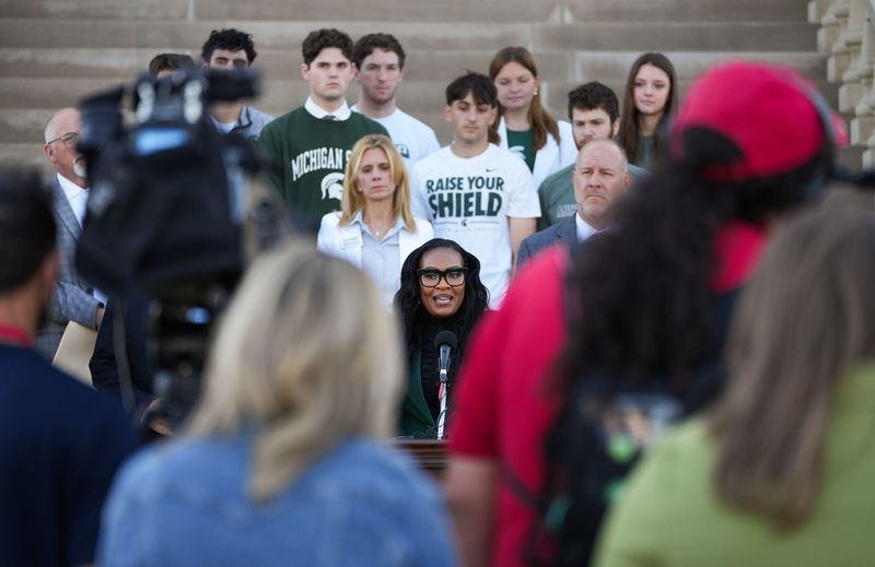 Michigan State University trustee Rema Vassar addresses members of the press, Wednesday, June 3, 2026, during a joint press conference with fellow board member Mike Balow, right, at the state Capitol in Lansing. The two defended their refusal to sign MSU's updated code of conduct agreement for trustees.