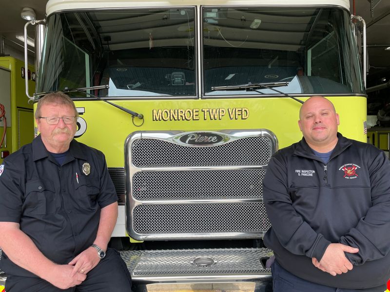 Calvin Schmitt (left) is shown with Scott Pancone at the Monroe Charter Township Fire Station.