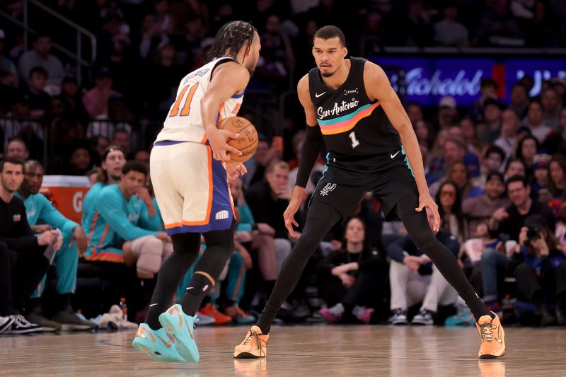 San Antonio Spurs center Victor Wembanyama defends New York Knicks guard Jalen Brunson during the third quarter at Madison Square Garden, March 1, 2026, in New York.