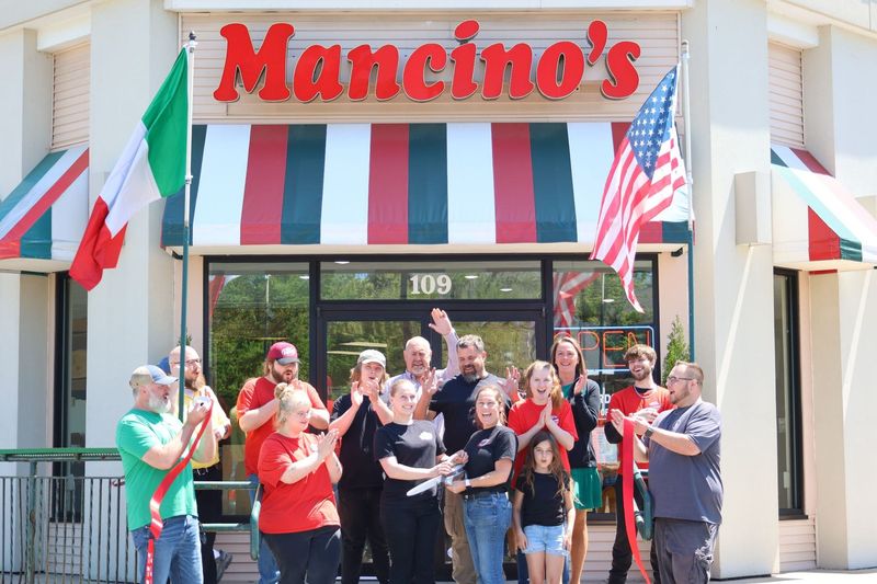 The Ramsby family participated in a ribbon-cutting ceremony with the Petoskey Regional Chamber of Commerce on May 28, 2026 at Mancino's of Petoskey.