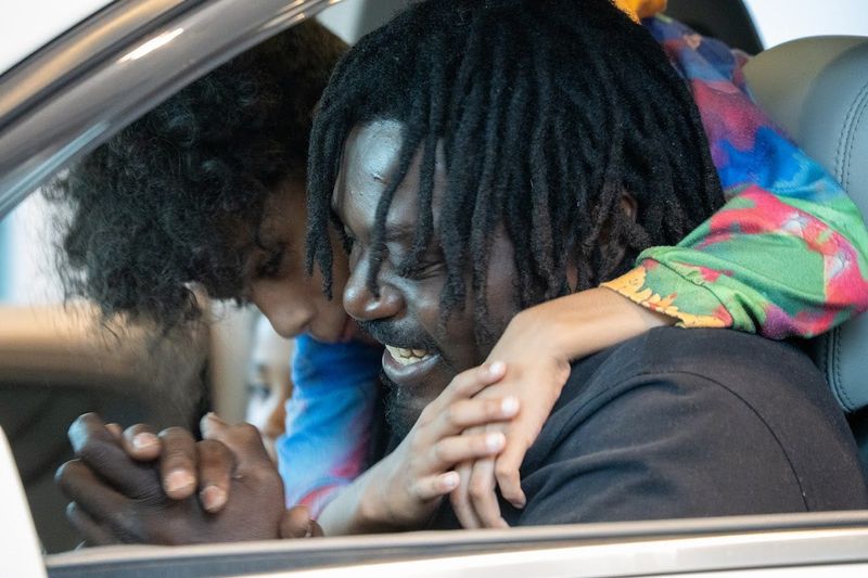 Marvin Davis and his son, Marvin Davis Jr, in their new 2015 GMC Acadia. National Automobile Dealers Association Chairperson Rob Cochran awarded two used vehicles to families on Wednesday, May 27, 2026, at his Pennsylvania dealership. The giveaway launched a national expansion of a program by Vehicles for Change, a Maryland-based nonprofit that offers $950 cars to low-income families.