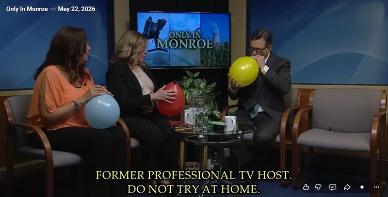 Kaye Lani Rae Rafko-Wilson and Michelle Baumann, hosts of "Only in Monroe," share helium balloons with guest host Stephen Colbert