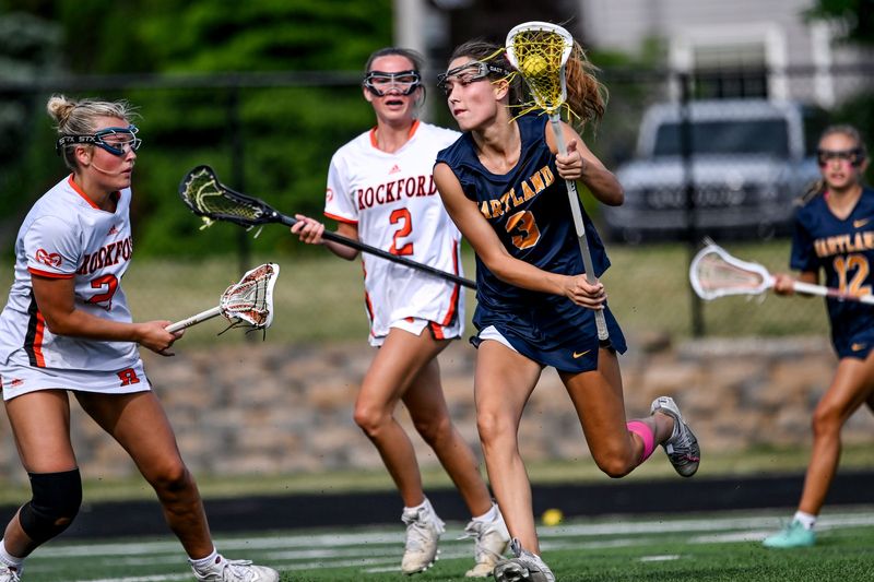 Hartland's Amanda Norton moves the ball against Rockford in the third quarter of the Division 1 girls lacrosse state semifinal on Wednesday, June 3, 2026, at East Lansing High School.
