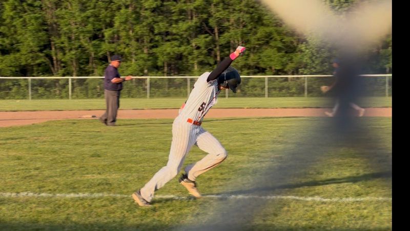 Senior Marshall Baker scores the game-winning run after Carson Young’s line drive.