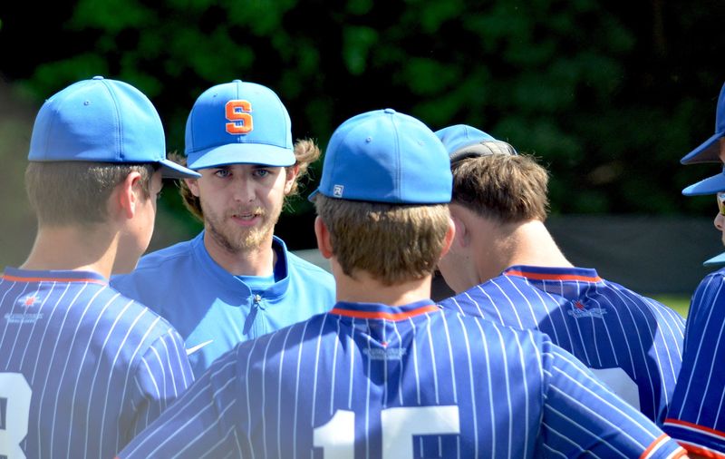 Saugatuck baseball coach Jaden Grigg talks to his team during the regional semifinals on Wednesday, June 3, at Kalamazoo Christian.