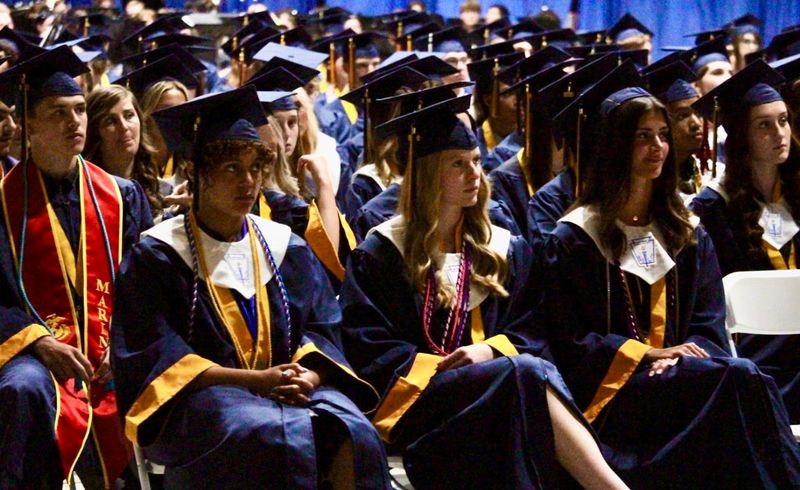 Graduates listen during Port Huron Northern High School's commencement ceremony at McMorran Place Arena in Port Huron on June 3, 2026.