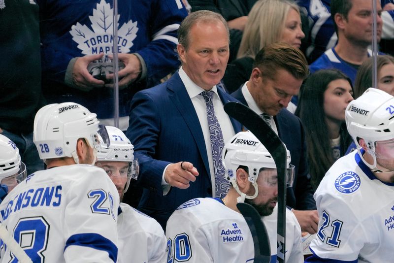 Lightning head coach Jon Cooper talks to his players during a break in the action against the Maple Leafs at Scotiabank Arena in 2025.