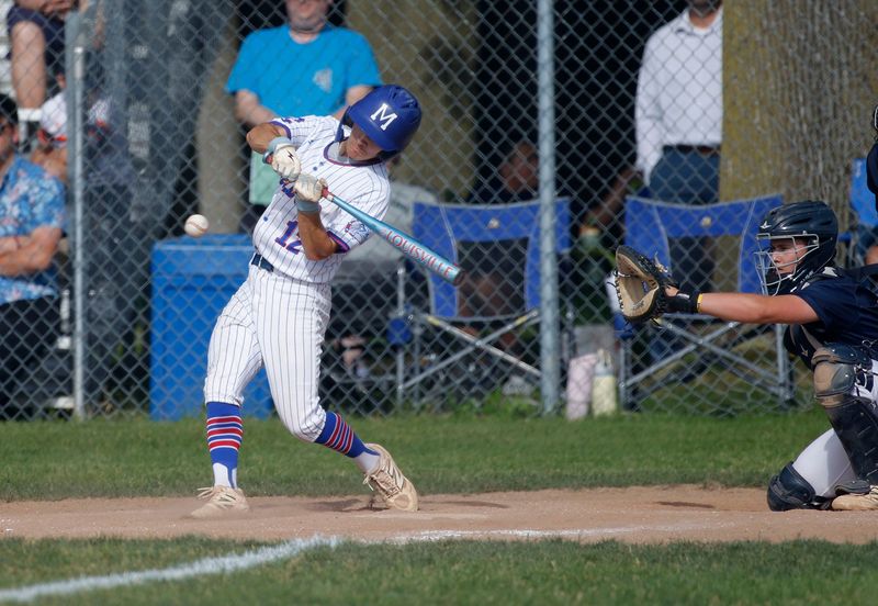 Mason's Travis Davis hits a triple against DeWitt, Wednesday, June 3, 2026, at Mason High School.