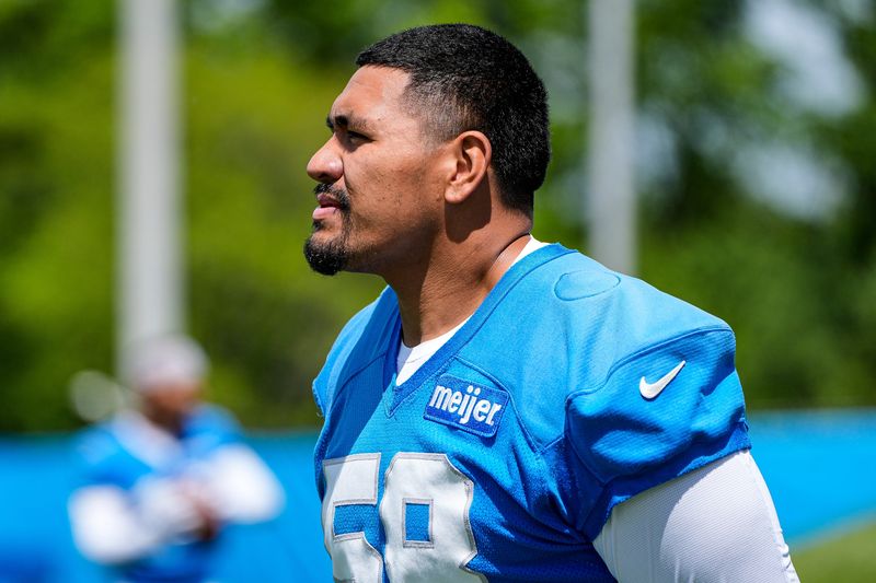 Detroit Lions offensive tackle Penei Sewell (58) looks on before practice during OTAs at Meijer Performance Center in Allen Park on Thursday, June 4, 2026.