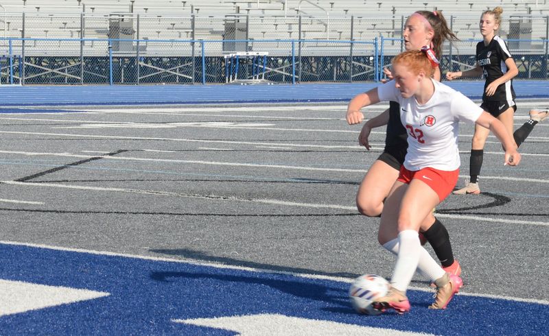 New Boston Huron's Avery Turk goes to the net against Mason in the finals of the Division 2 Girls Soccer Regional at Ypsilanti Lincoln on Thursday, June 4, 2026.