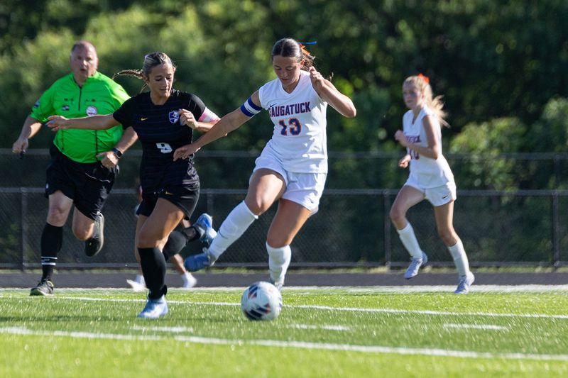 Saugatuck's Neave Rewa takes the ball up field during the Division 4 regional final on Thursday, June 4 against Kalamazoo Christian.
