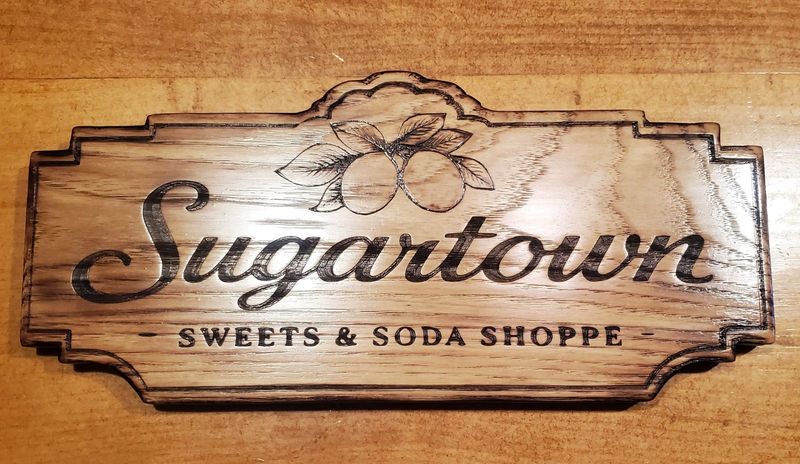 The sign for Sugartown Sweets & Soda Shoppe in Blissfield.
