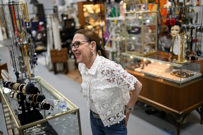 Deborah Slobin, co-owner of Le Shoppe Modern in Keego Harbor, is among the operators of Michigan resale and reuse businesses seeing an uptick in sales amid shifting trade policy and persistent inflation.