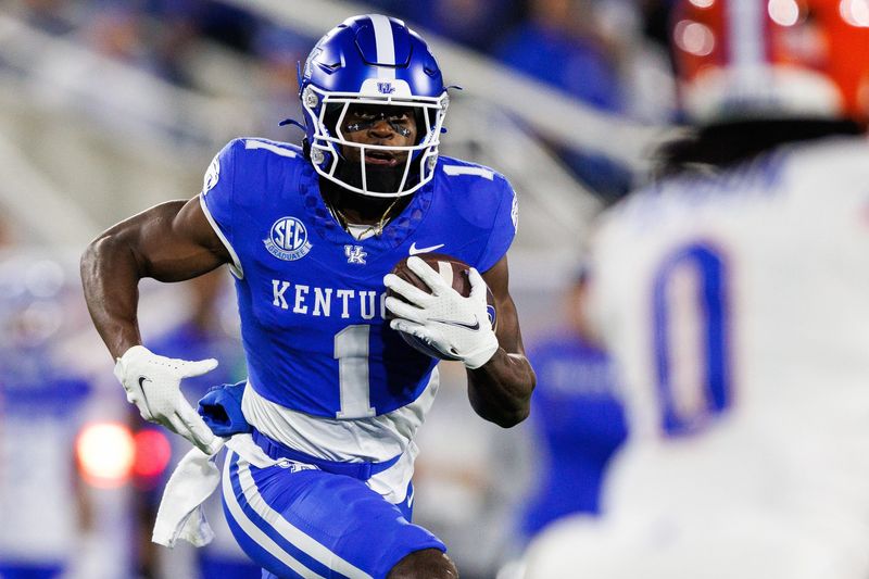 Nov 8, 2025; Lexington, Kentucky, USA; Kentucky Wildcats wide receiver Kendrick Law (1) runs the ball during the first quarter against the Florida Gators at Kroger Field. Mandatory Credit: Jordan Prather-Imagn Images