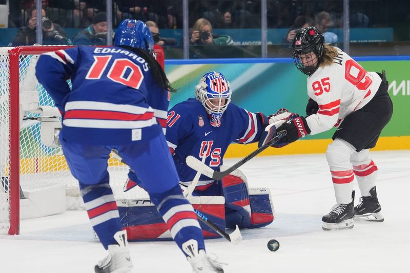 Aerin Frankel (31) of the United States blocks the shot by Daryl Watts (95) of Canada in the women's ice hockey gold medal game during the Milano Cortina 2026 Olympic Winter Games at Milano Santagiulia Ice Hockey Arena.