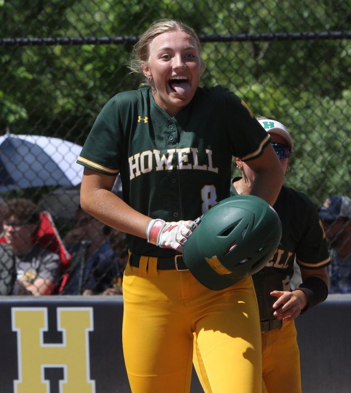 Zoey Overton celebrates after hitting a two-run home run to get Howell on the board in the first inning of a 7-3 victory over Portage Central in a Division 1 regional championship softball game on Saturday, June 6, 2026 at Hartland High School.