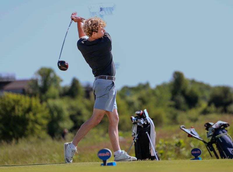 Holland's Preston Logan competes at the Division 2 state golf tournament on Saturday, June 6, at The Meadows on the campus of Grand Valley State University.