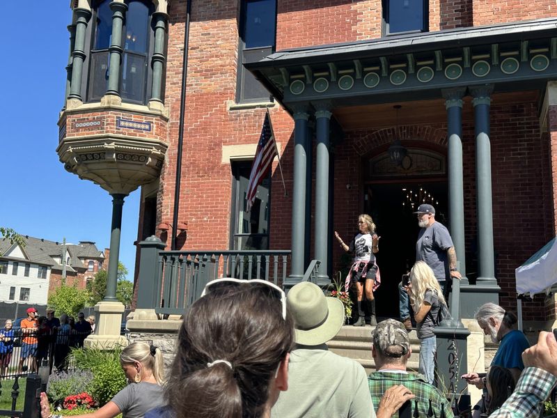 Nicole Curtis, a native Michiganian known for restoring homes on "Rehab Addict," addresses attendees at the opening of the renovated Ransom Gillis home on June 7, 2026.