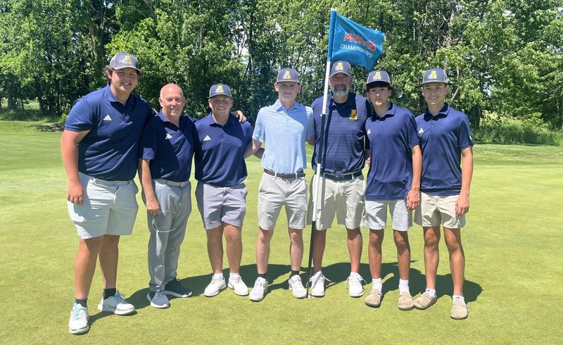 Airport's boys golf team (left to right) Landon McGregor, coach Willie Hammar, Brayden Siders, Sam Mitacariu, coach Scharf, Cade Horner and Evan Mullins pose for a photo at the state finals on Saturday, June 6, 2026.