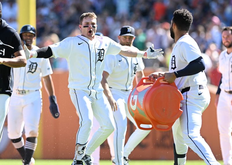 Tigers’ Kevin McGonigle (7) looks towards Riley Greene who is about to soak him after McGonigle singles with two RBIs to win the game in the ninth inning. Detroit Tigers take on the Seattle Mariners on June 7, 2026 at Comerica Park in Detroit. Tigers win, 5-4.