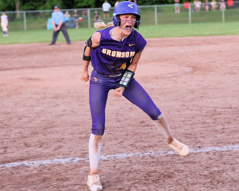 Bronson's Ashlynn Harris reacts after earning a walk in the seventh inning of the regional finals on Saturday.