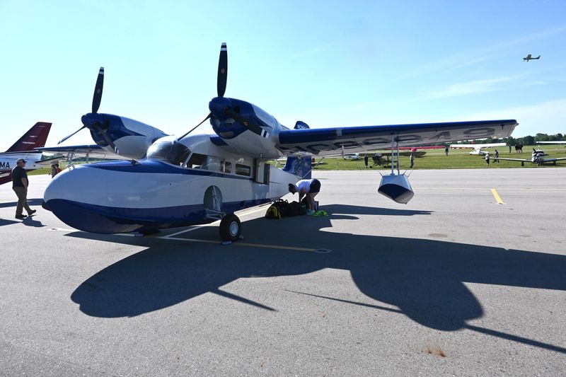 Commercial pilot Mike Pratt of Louisville, Kentucky, flew in his 1947 Super Widgeon, one of two Grumman flying boats.
