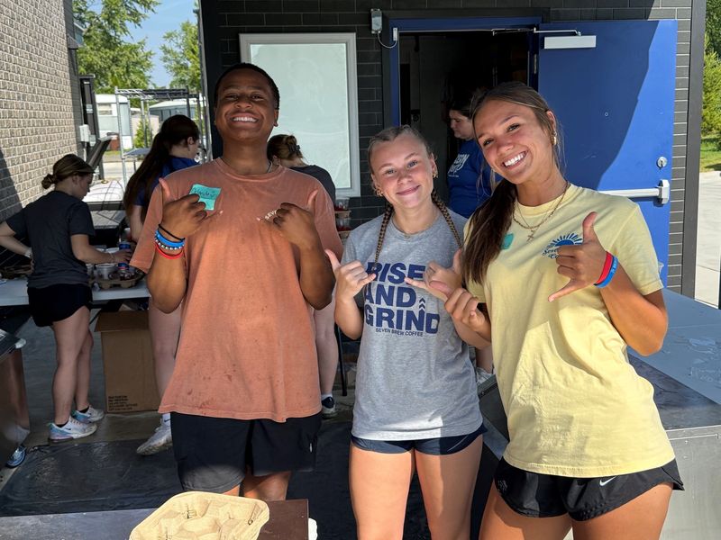 7 Brew employees Orlando Griggs, Scarlett Trami, and Sammy Spain prepare for the location's opening.
