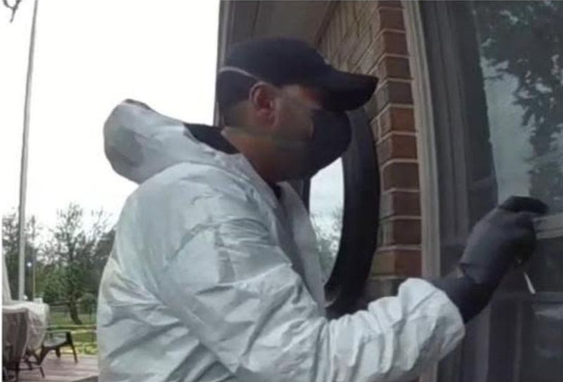 Police said this man tried to break into two Livonia homes on May 13, 2026, and May 14, 2026, while wearing a white hazmat suit.