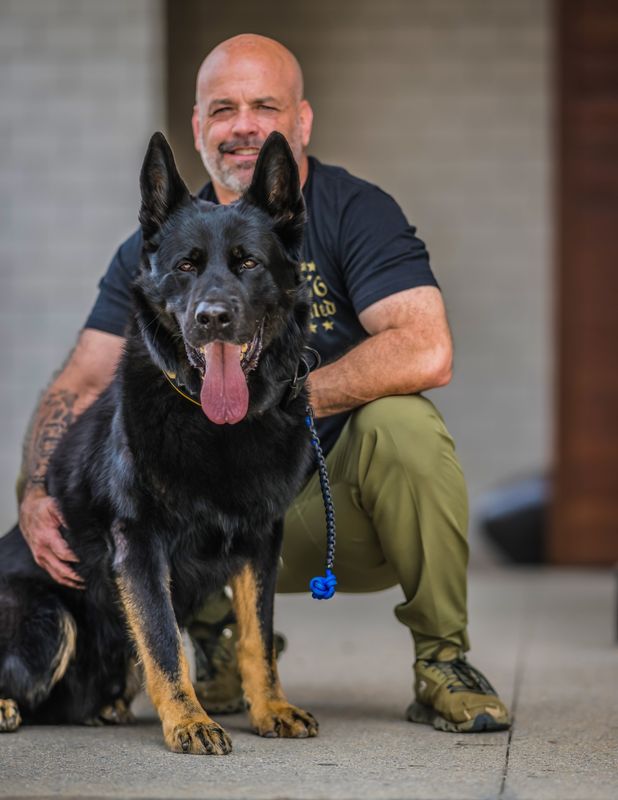 A photo of K9 Mattis and handler Sgt. Mark Tappan of Alpharetta, Georgia, police. Tappan worked with Mattis, a German shepherd, for more than six years before adopting Mattis in retirement. Mattis died in August 2025 at age 12 and will be interred at the Michigan War Dog Memorial cemetery in South Lyon, Michigan, on June 27, 2026.